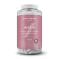 Envase de 90 tabletas de biotina Myvitamins, frasco con etiqueta rosada